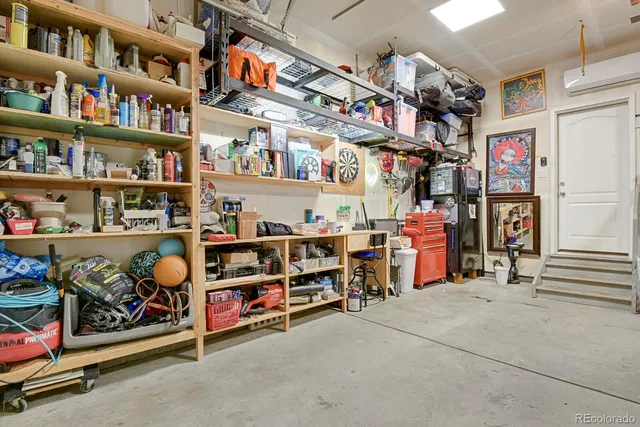 a view of a balcony with two chairs and a stove