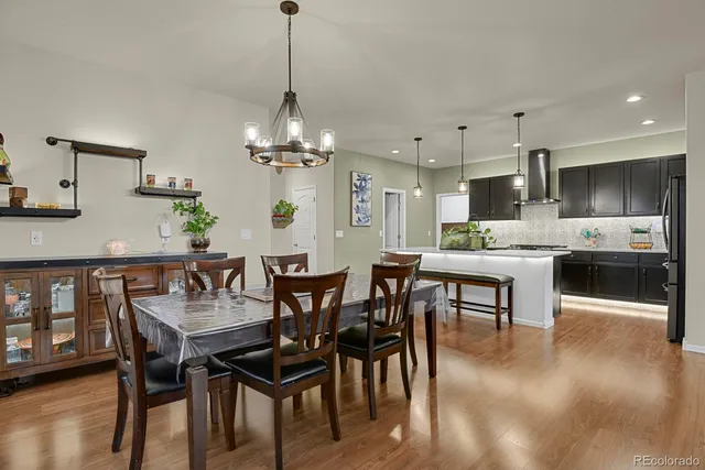 a view of a dining room with furniture and wooden floor