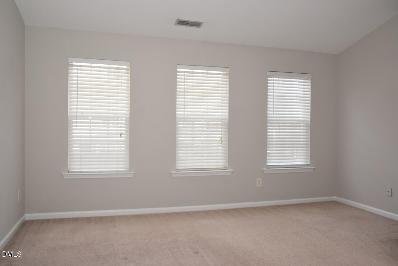8269 City Loft Court Raleigh, NC 27613 - Photo 13 of 26 an empty room with windows