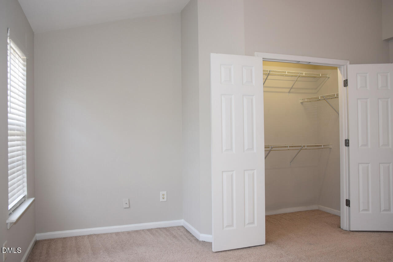 8269 City Loft Court Raleigh, NC 27613 - Photo 14 of 26 an empty room with windows
