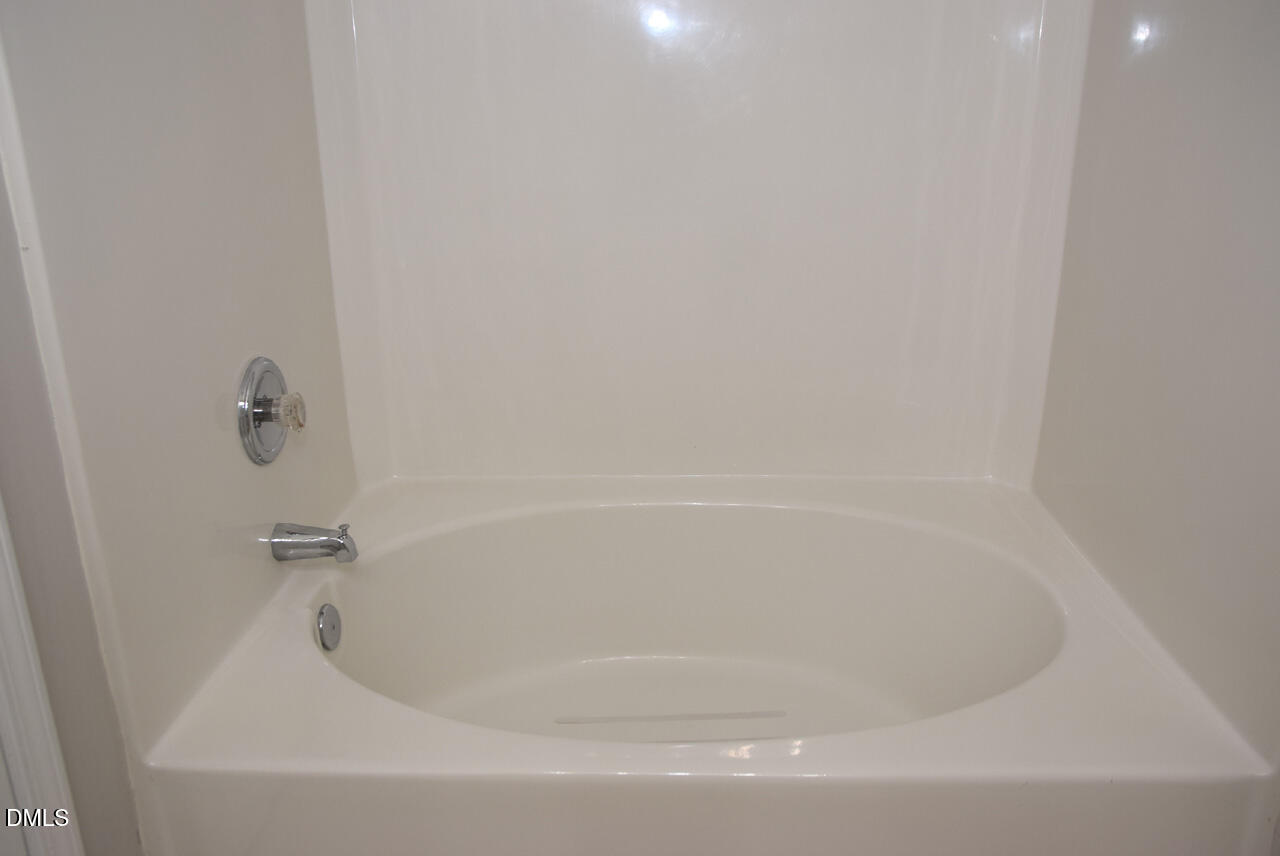 8269 City Loft Court Raleigh, NC 27613 - Photo 17 of 26 a close view of a bathtub in bathroom