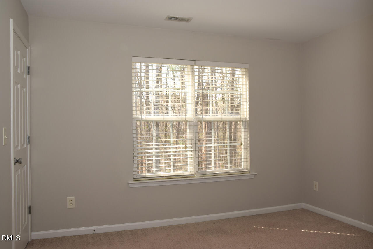 8269 City Loft Court Raleigh, NC 27613 - Photo 18 of 26 an empty room with a window