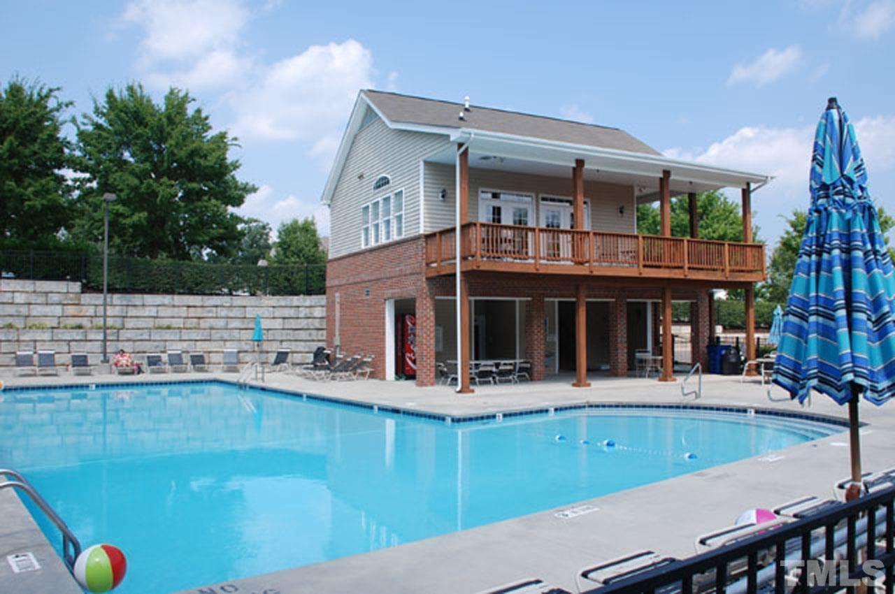 8269 City Loft Court Raleigh, NC 27613 - Photo 24 of 26 a view of house with swimming pool and chairs