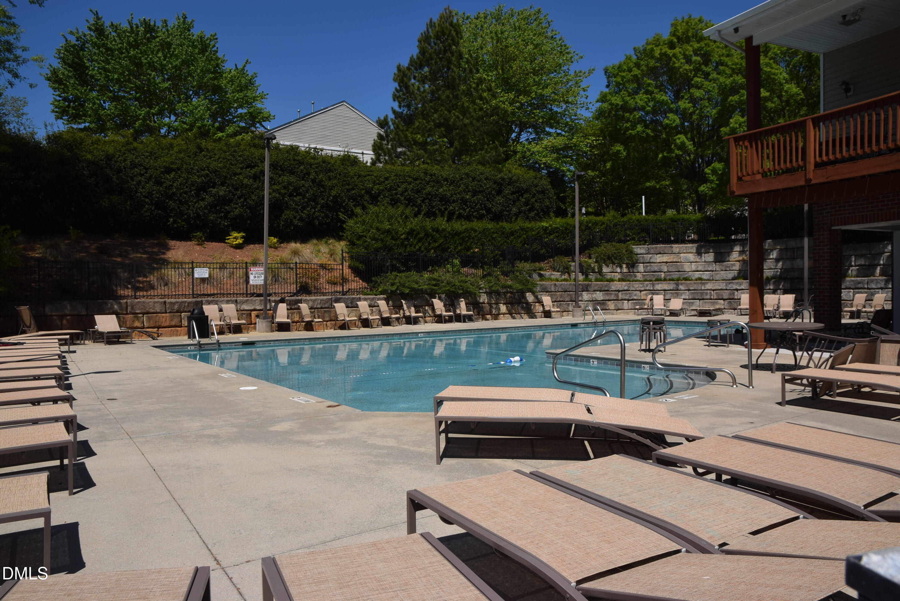 8269 City Loft Court Raleigh, NC 27613 - Photo 25 of 26 a view of a swimming pool with chairs