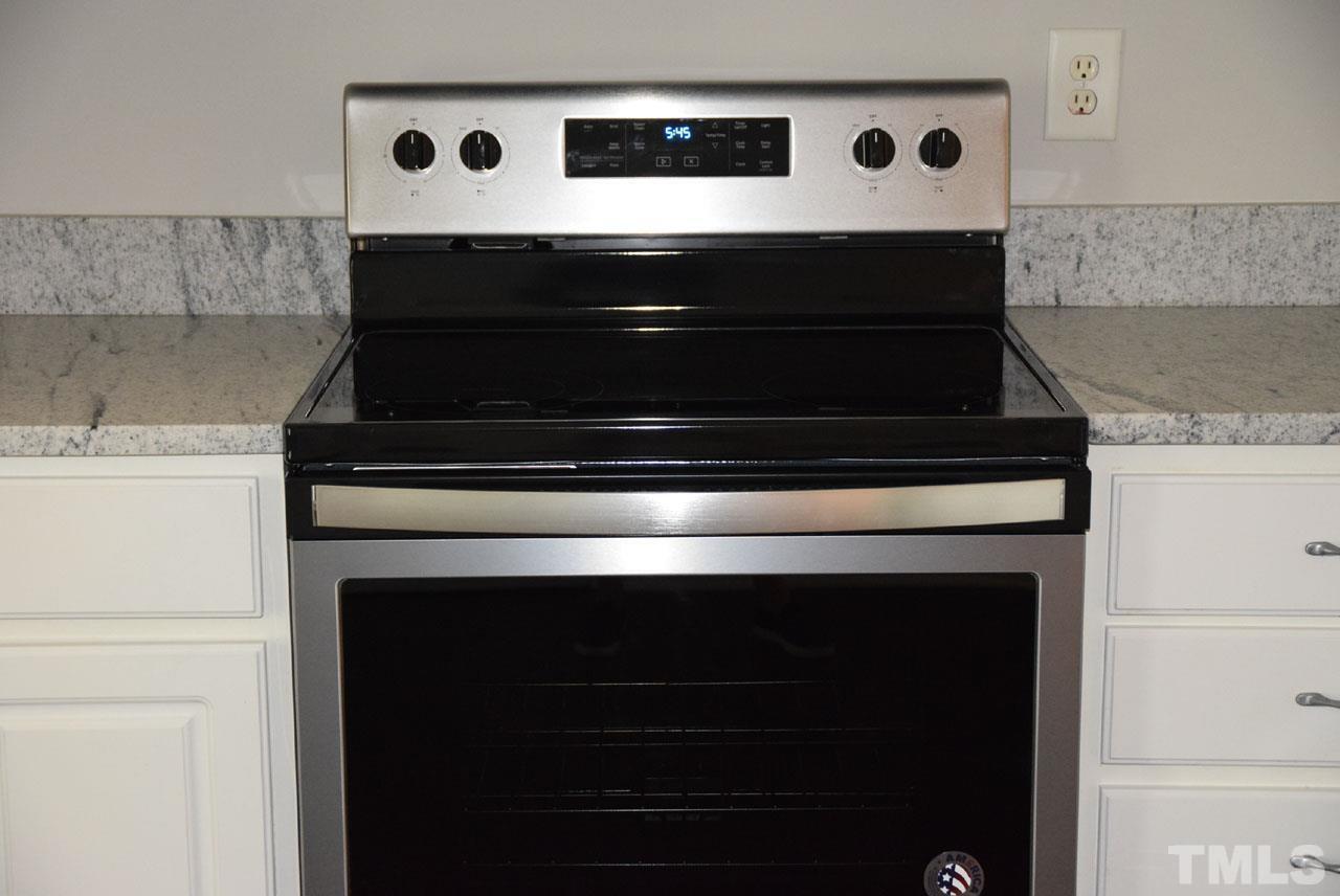 8269 City Loft Court Raleigh, NC 27613 - Photo 9 of 26 a stove top oven sitting inside of a kitchen