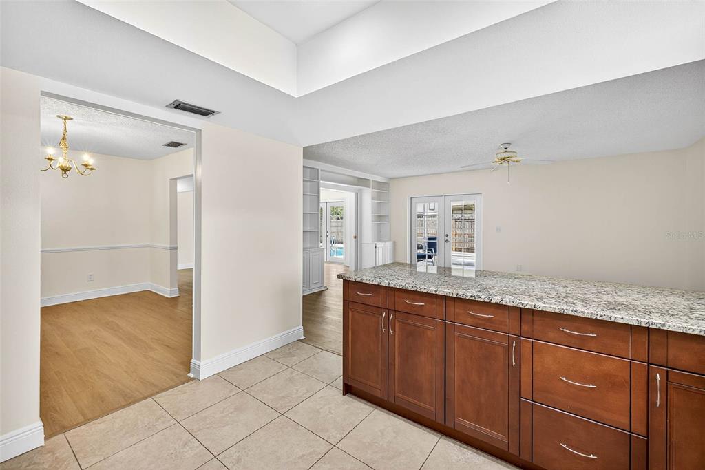 11009 Cinderlane Place Temple Terrace, FL 33617 - Photo 27 of 56 a bathroom with a granite countertop sink and a mirror