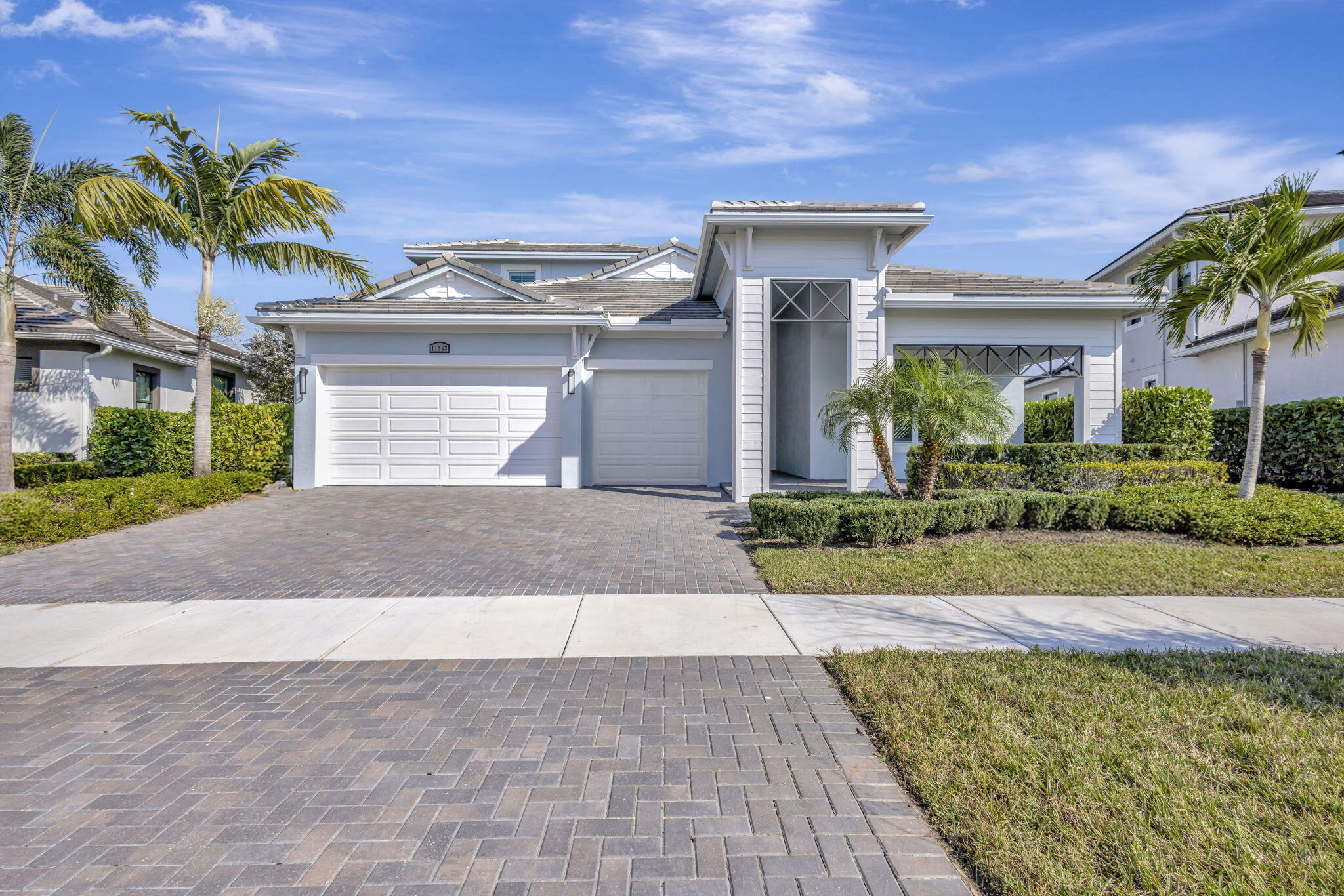 11953 Southwest Vano Way Port Port St. Lucie, FL 34987 - Photo 1 of 74 a front view of a house with a yard and potted plants