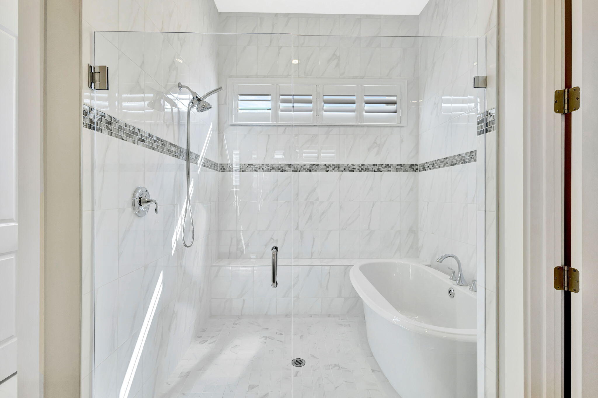 11953 Southwest Vano Way Port Port St. Lucie, FL 34987 - Photo 21 of 74 a bathroom with a bathtub and a shower