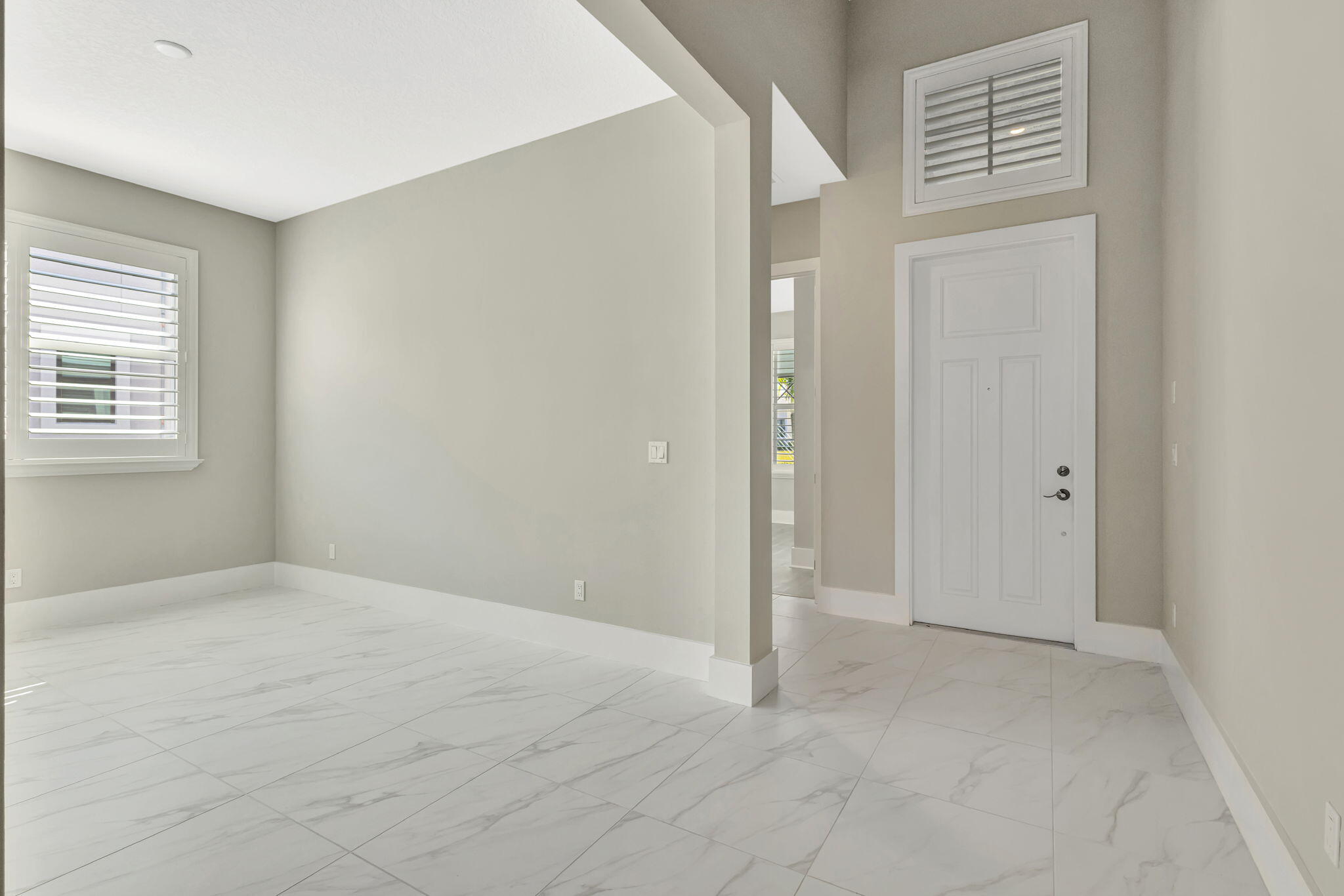 11953 Southwest Vano Way Port Port St. Lucie, FL 34987 - Photo 22 of 74 a view of an empty room with a window