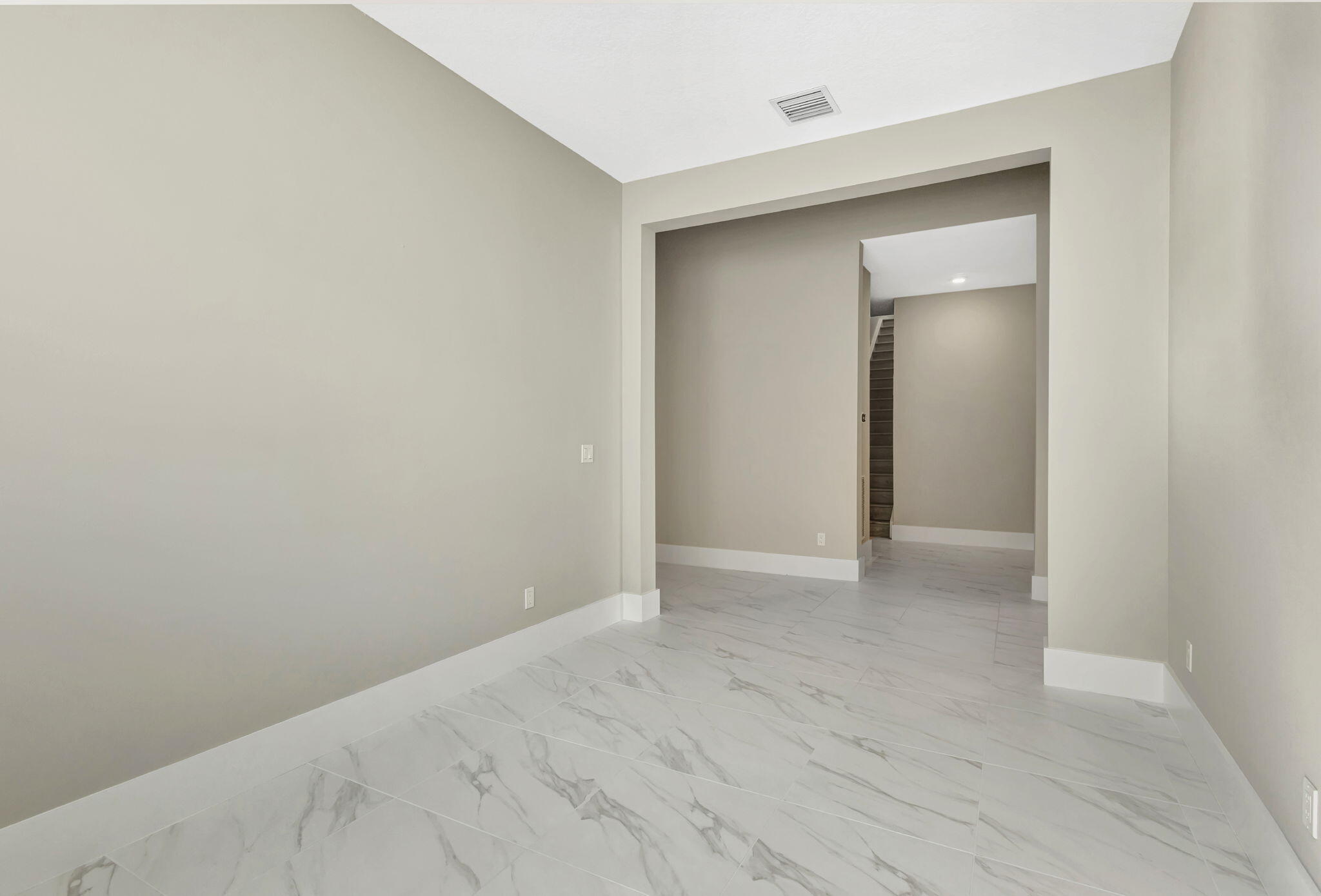 11953 Southwest Vano Way Port Port St. Lucie, FL 34987 - Photo 27 of 74 a view of an empty room with wooden floor and closet