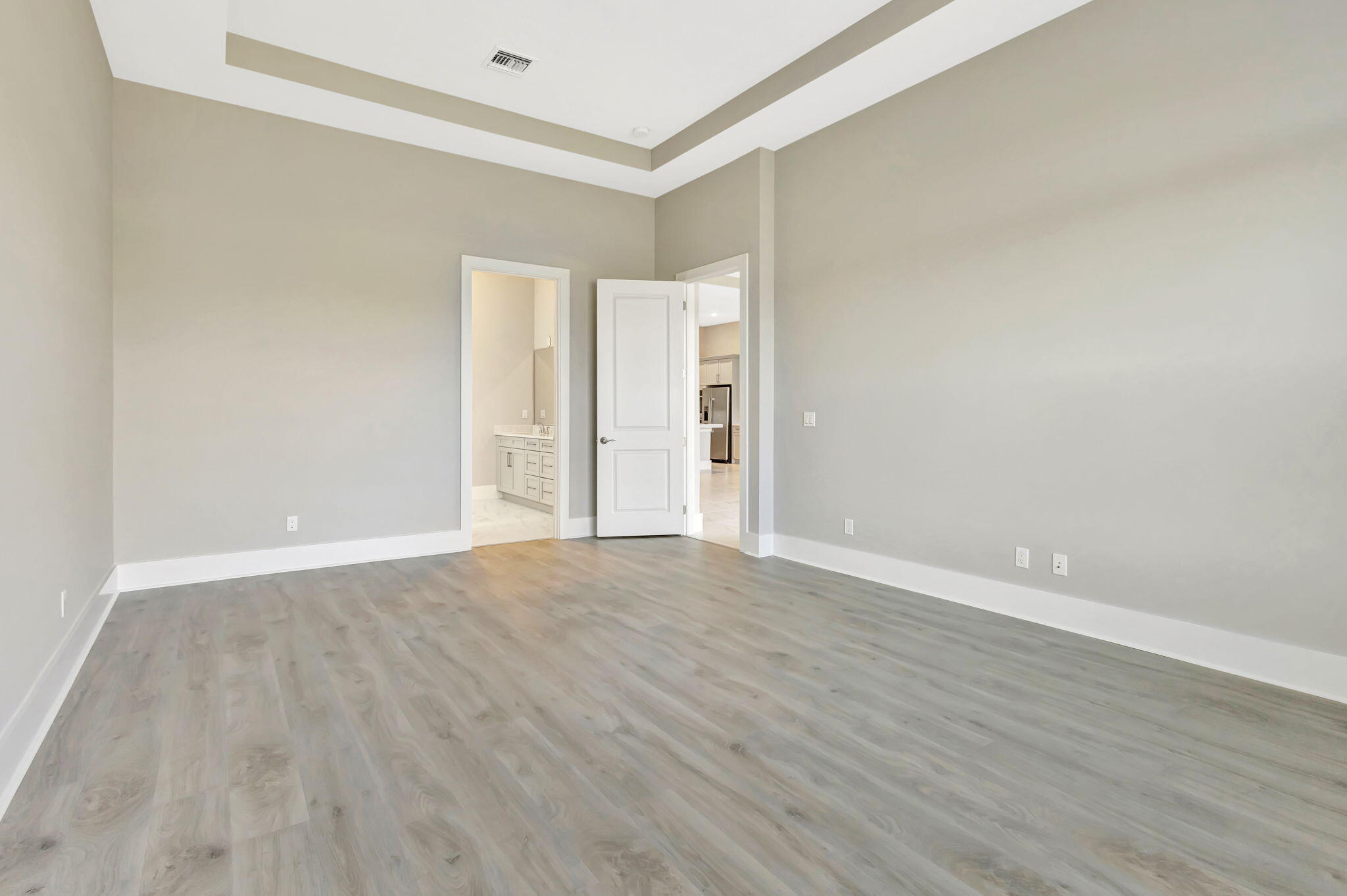 11953 Southwest Vano Way Port Port St. Lucie, FL 34987 - Photo 35 of 74 a view of an empty room with wooden floor and a window