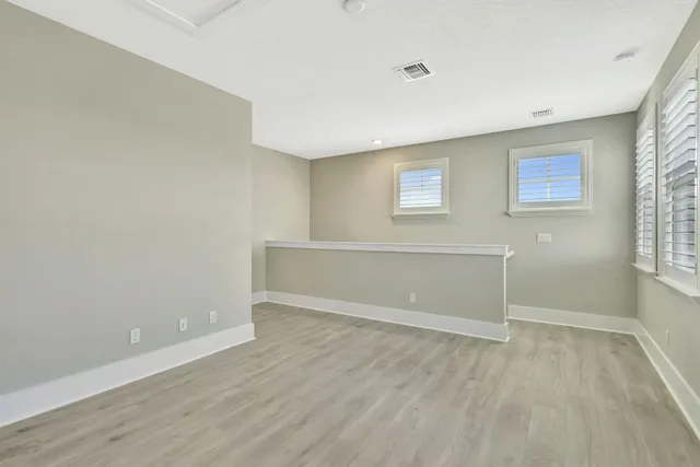 a view of a lake with houses in the back