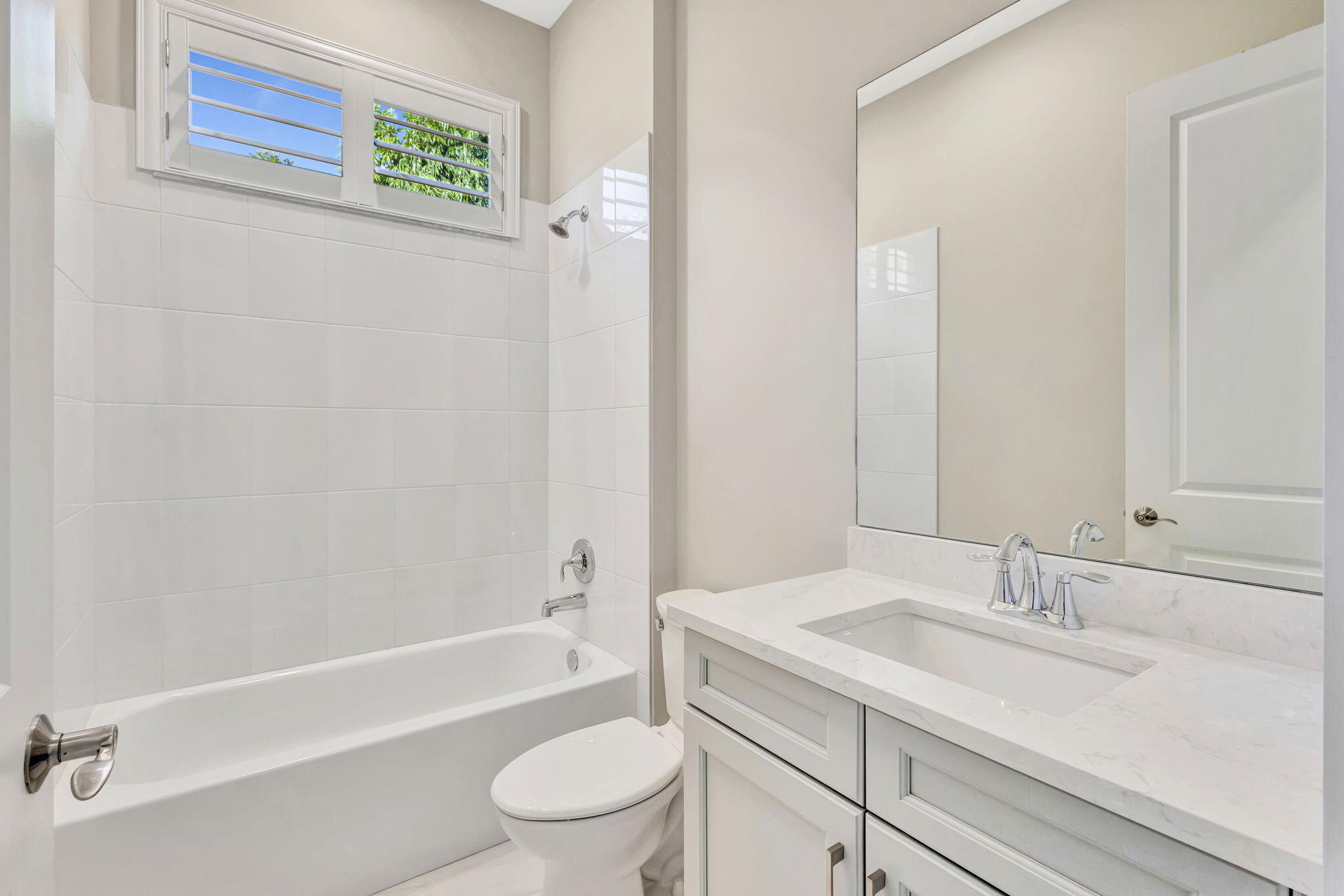 11953 Southwest Vano Way Port Port St. Lucie, FL 34987 - Photo 42 of 74 a bathroom with a sink toilet and shower