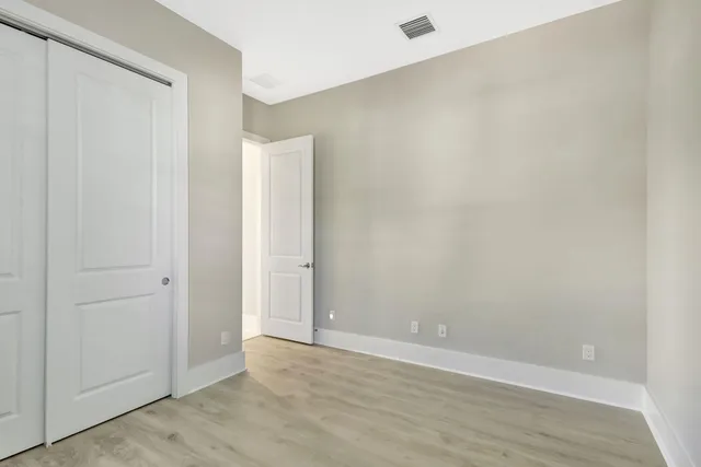 an aerial view of residential houses with outdoor space and swimming pool