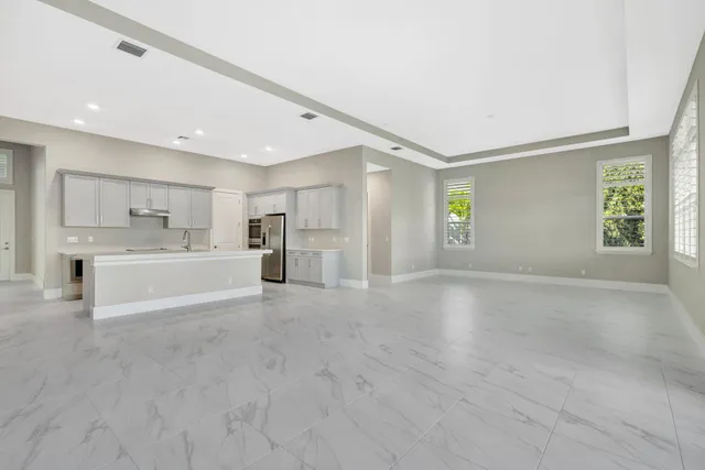 an aerial view of a house with a swimming pool