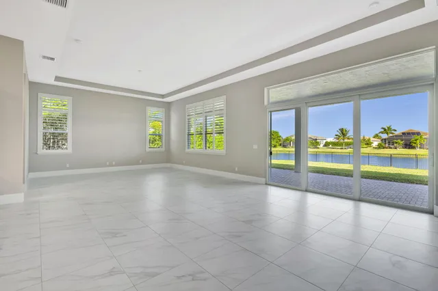 an aerial view of a house with a lake view