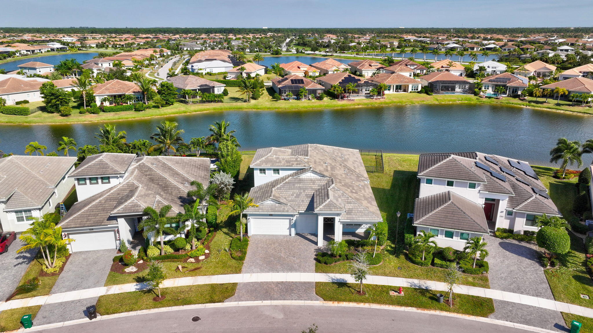 11953 Southwest Vano Way Port Port St. Lucie, FL 34987 - Photo 59 of 74 an aerial view of residential houses with outdoor space and lake view
