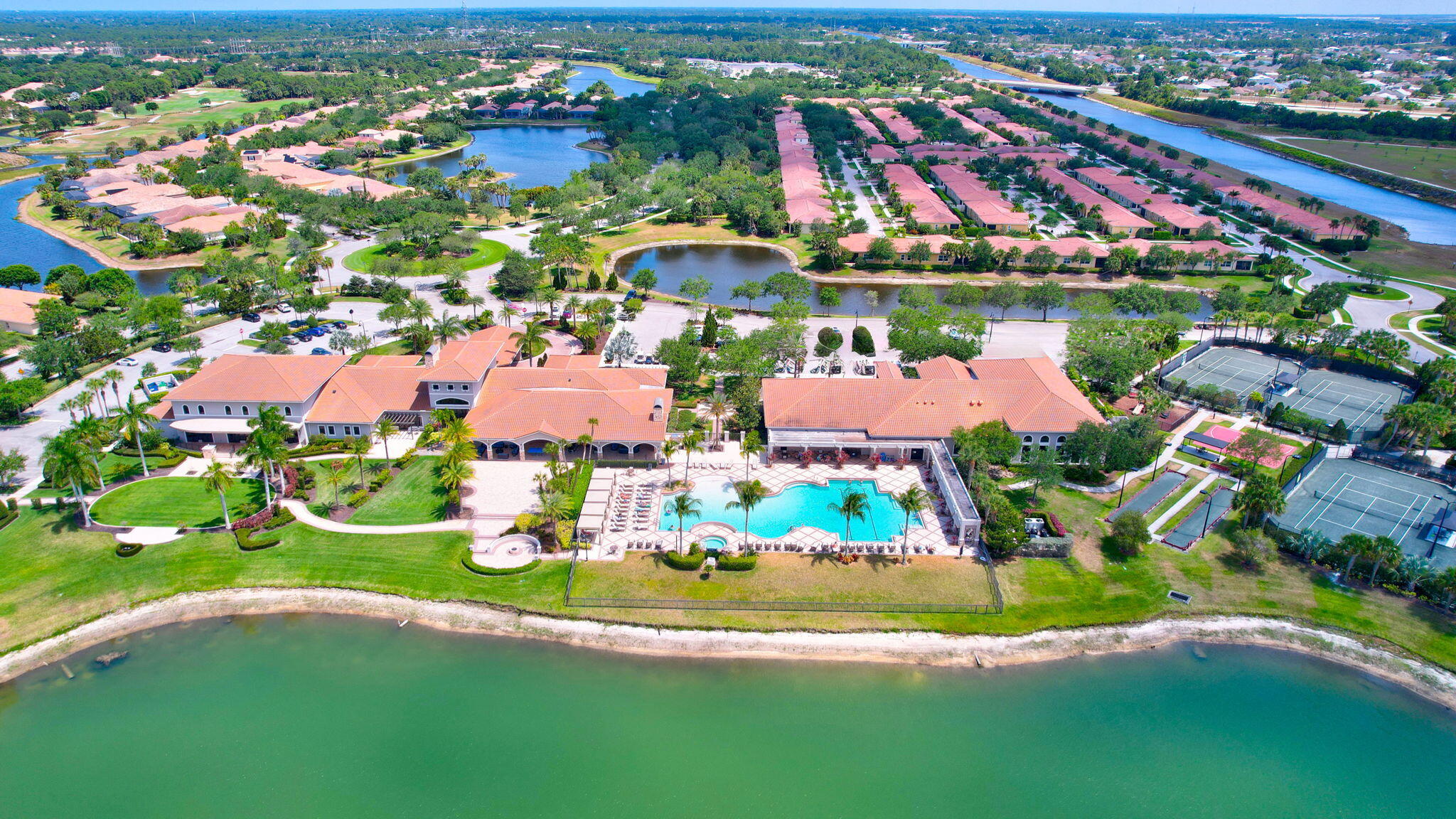 11953 Southwest Vano Way Port Port St. Lucie, FL 34987 - Photo 72 of 74 an aerial view of residential houses with outdoor space and swimming pool