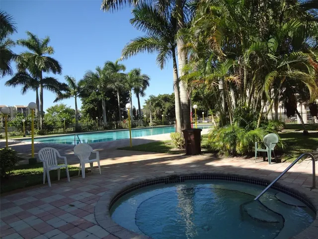 a backyard of a house with yard and outdoor seating