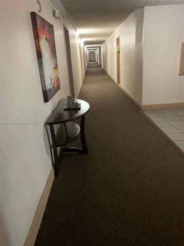 a view of a hallway with chairs