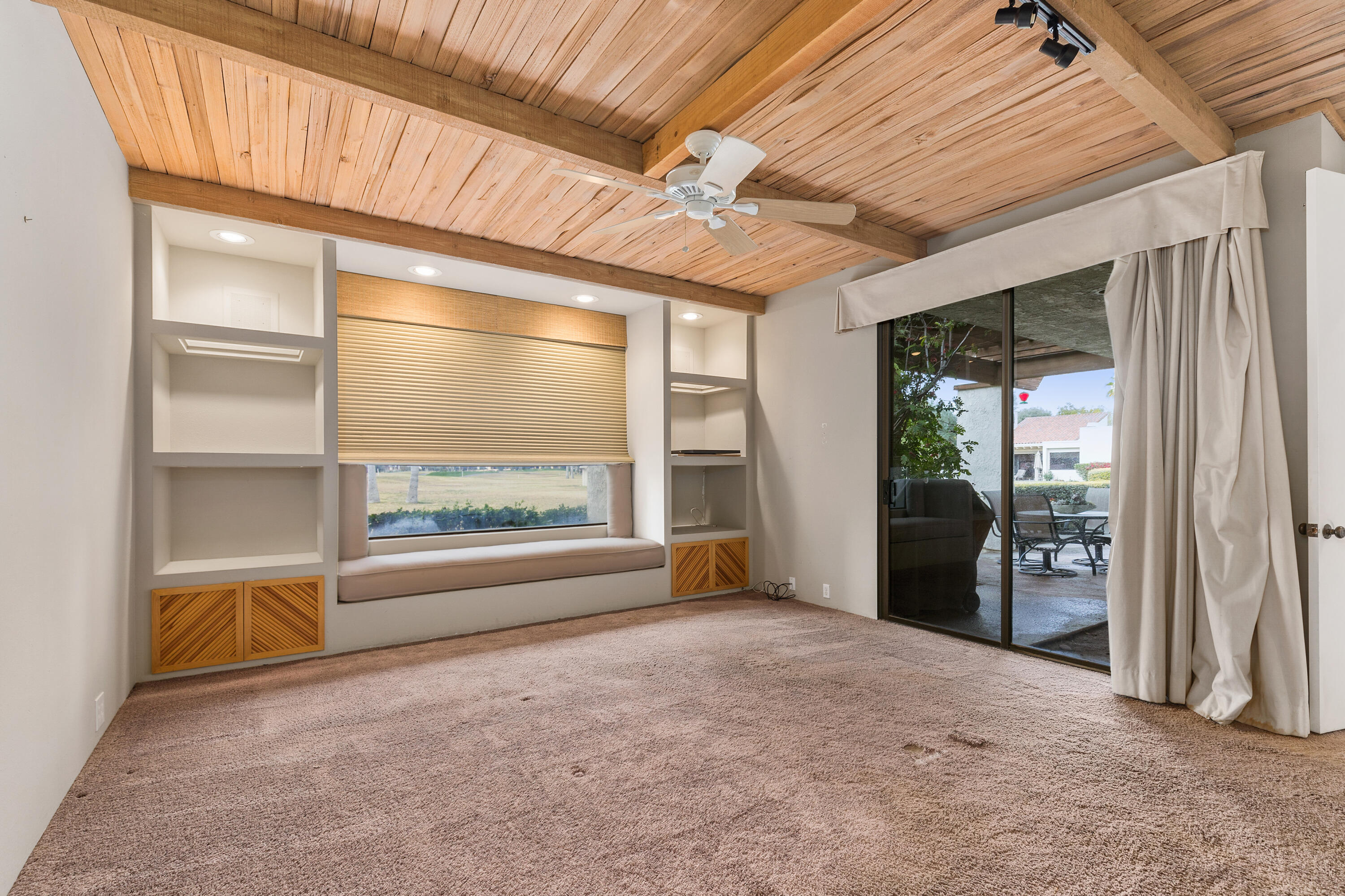 722 Inverness Drive Rancho Mirage, CA 92270 - Photo 25 of 59 an empty room with floor to ceiling windows and outdoor view