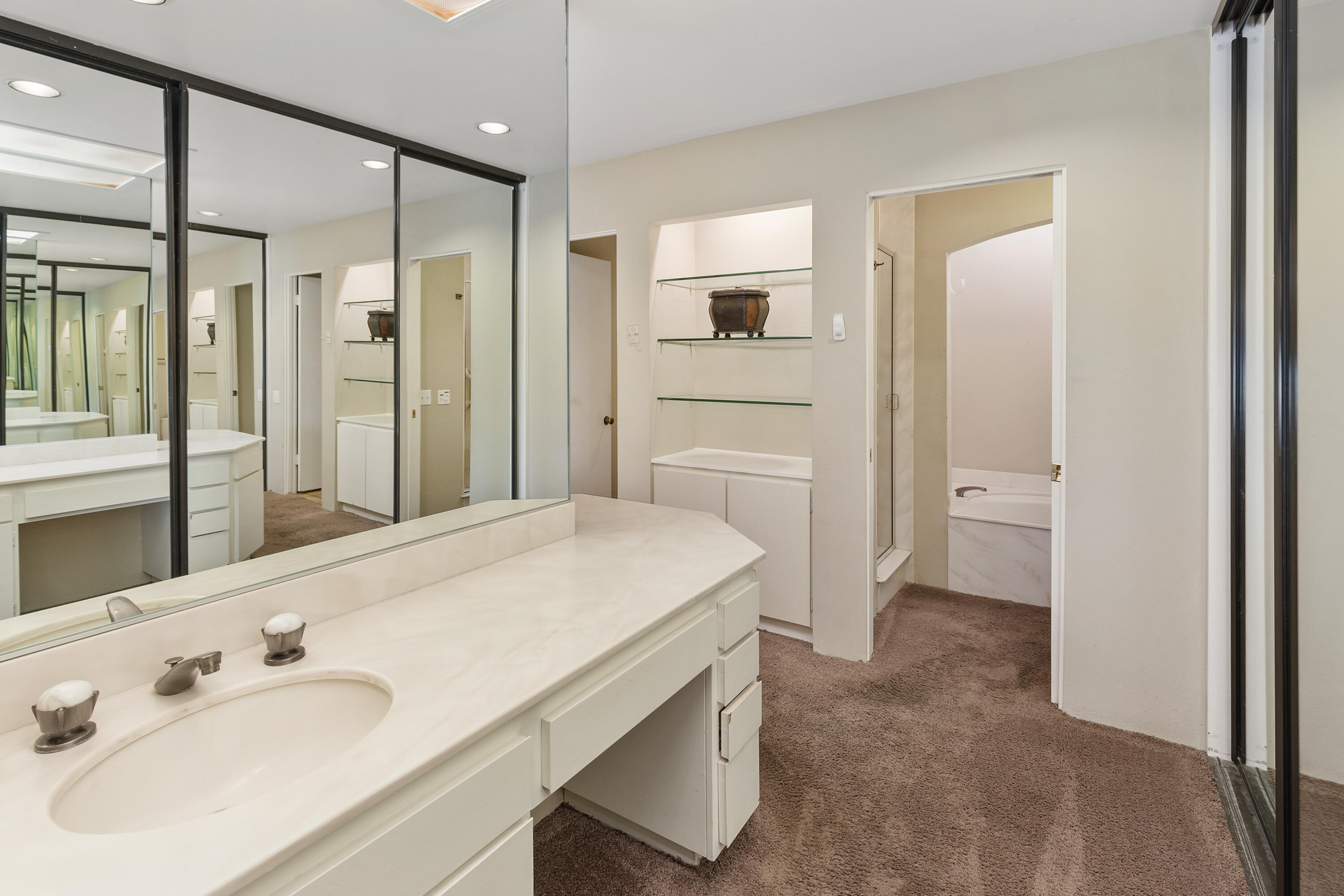 722 Inverness Drive Rancho Mirage, CA 92270 - Photo 27 of 59 a bathroom with a sink a toilet and shower
