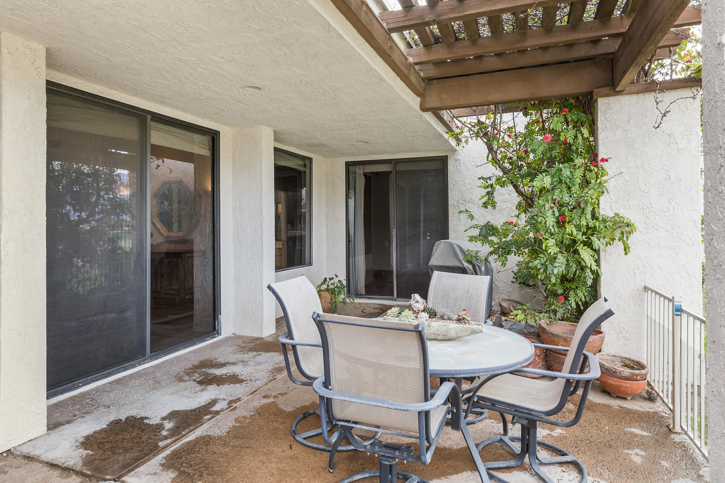 722 Inverness Drive Rancho Mirage, CA 92270 - Photo 29 of 59 a patio with yard glass top table and chairs