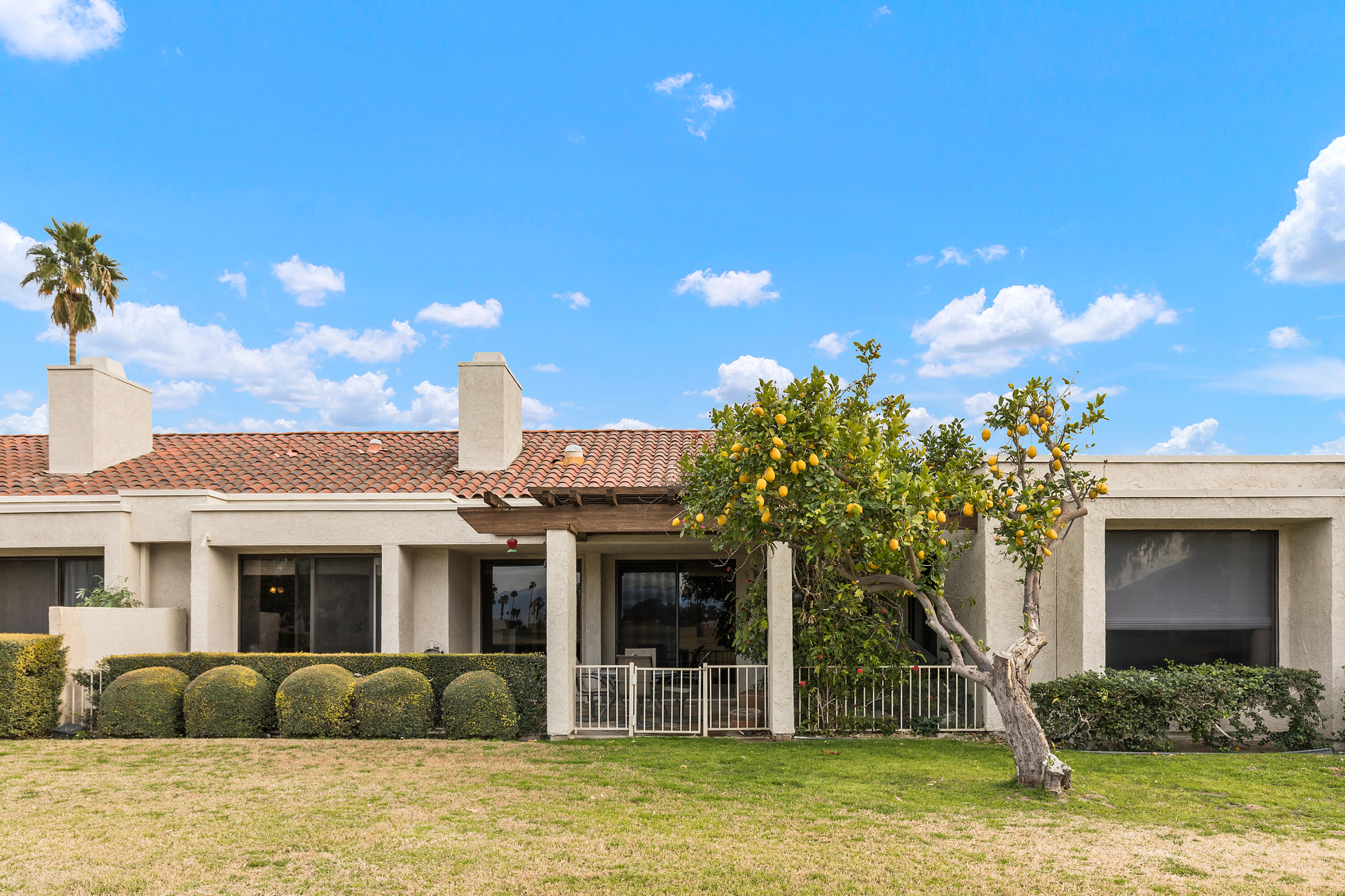 722 Inverness Drive Rancho Mirage, CA 92270 - Photo 31 of 59 a front view of a house with a yard