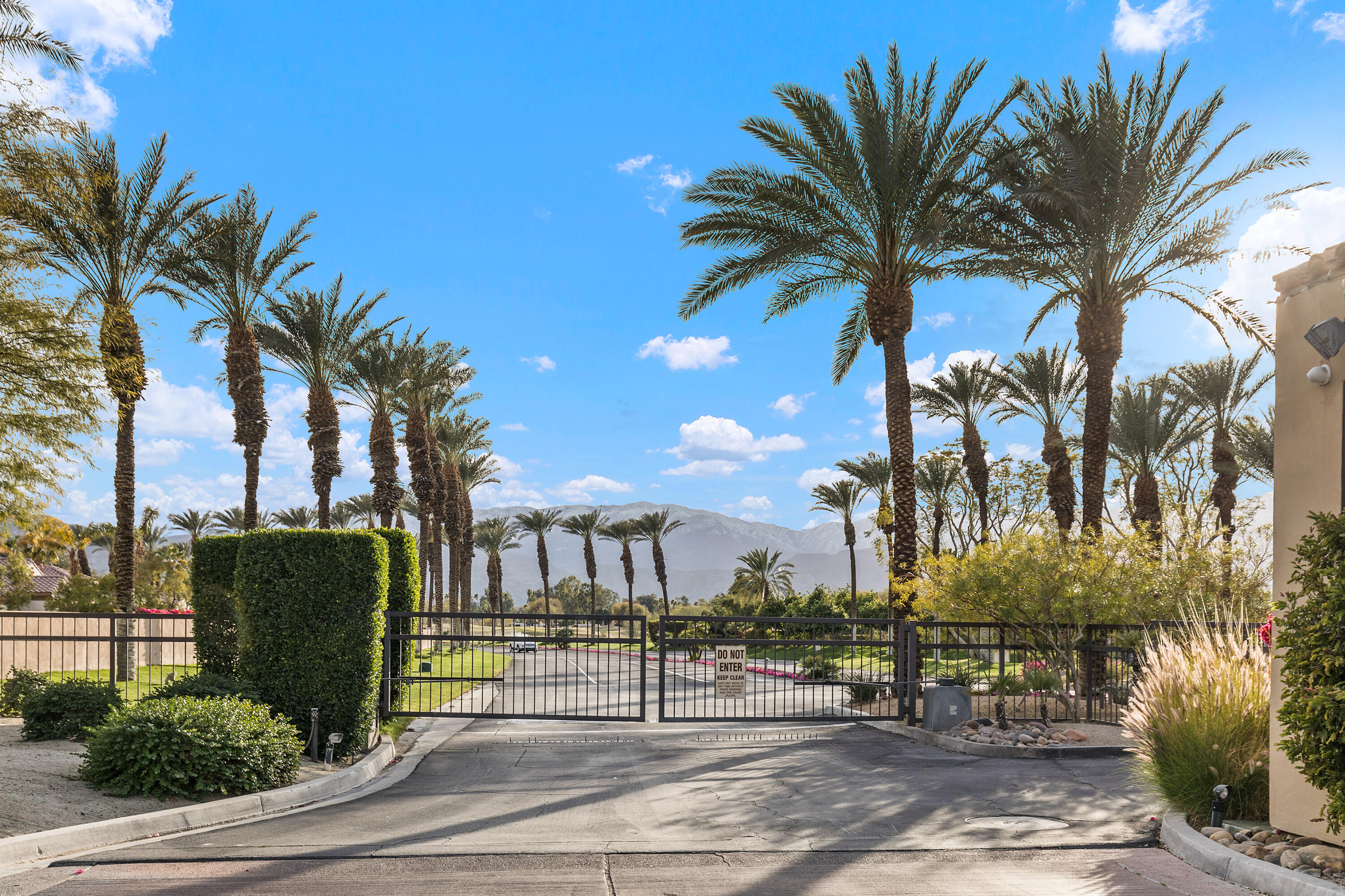 722 Inverness Drive Rancho Mirage, CA 92270 - Photo 40 of 59 a view of a palm trees in front of a building