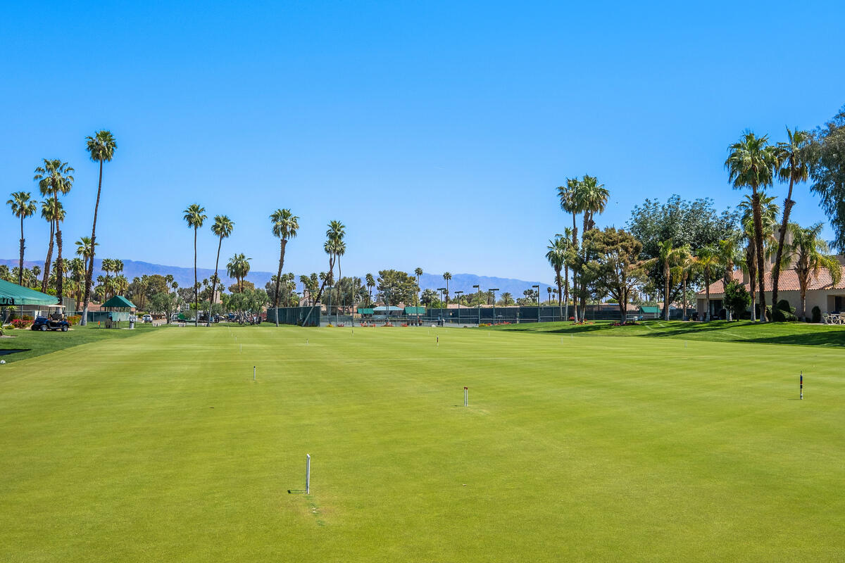 722 Inverness Drive Rancho Mirage, CA 92270 - Photo 48 of 59 a view of a large body of water with lots of palm trees