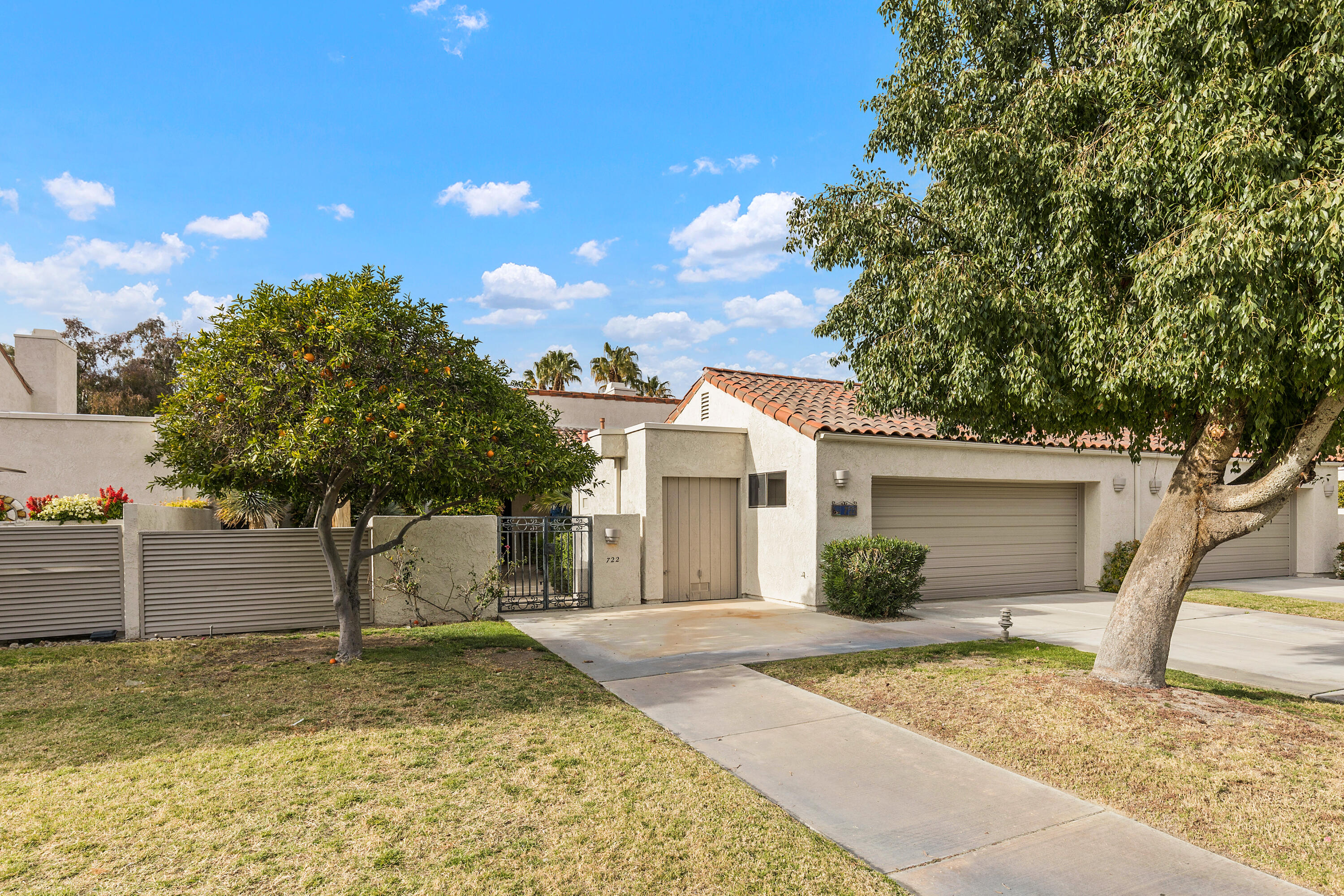 722 Inverness Drive Rancho Mirage, CA 92270 - Photo 8 of 59 a view of a house with a tree and plants