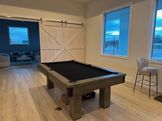 9001 Gasparilla Road, Unit 99 Placida, FL 33947 - Photo 6 of 75 a room with wooden floor and furniture