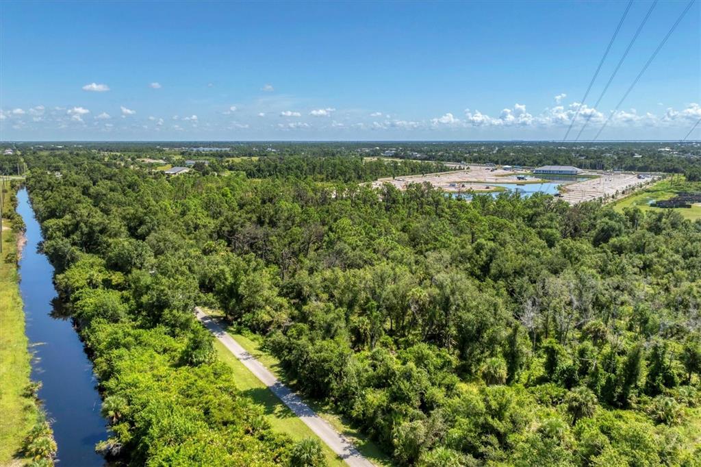 9001 Gasparilla Road, Unit 99 Placida, FL 33947 - Photo 75 of 75 a view of a lake from a yard