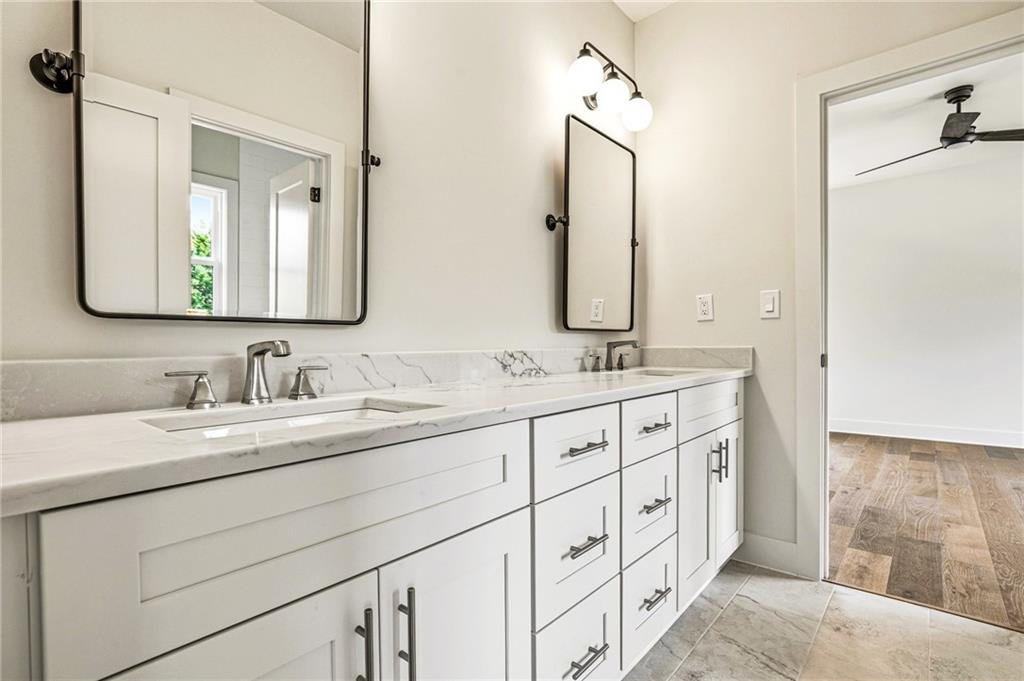 1967 Highgrove Court Decatur, GA 30033 - Photo 41 of 60 a bathroom with double sink and a mirror