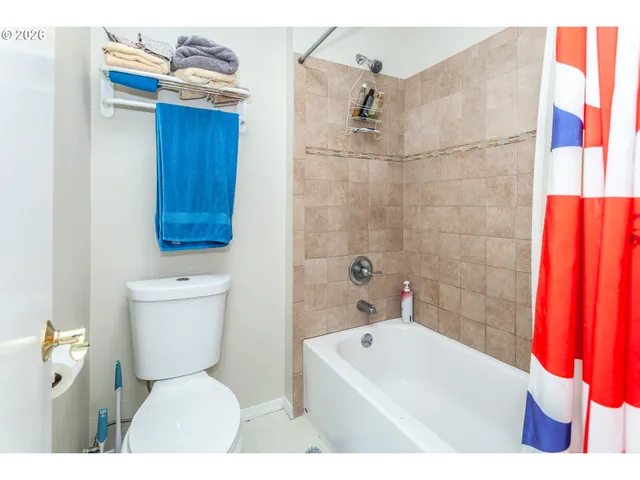 a bathroom with a toilet sink and bathtub