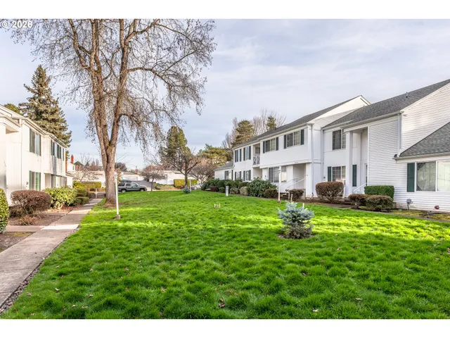 a house view with a sitting space and garden