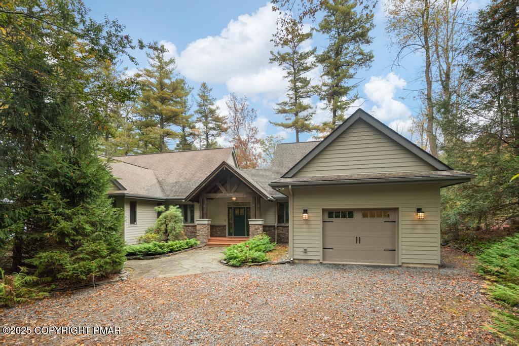 106 Waygood Way Pocono Pines, PA 18350 - Photo 2 of 66 a front view of a house with garden