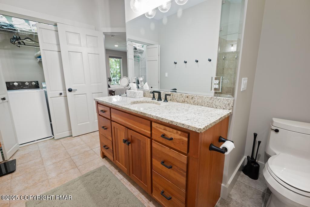 106 Waygood Way Pocono Pines, PA 18350 - Photo 21 of 66 a bathroom with a granite countertop sink mirror vanity and toilet