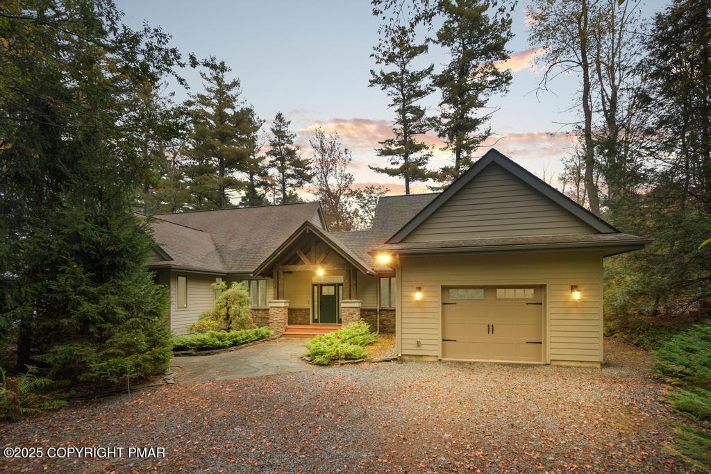 106 Waygood Way Pocono Pines, PA 18350 - Photo 3 of 66 a view of a house with a yard and garage