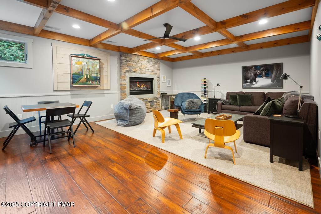 106 Waygood Way Pocono Pines, PA 18350 - Photo 33 of 66 a living room with furniture a flat screen tv and kitchen view
