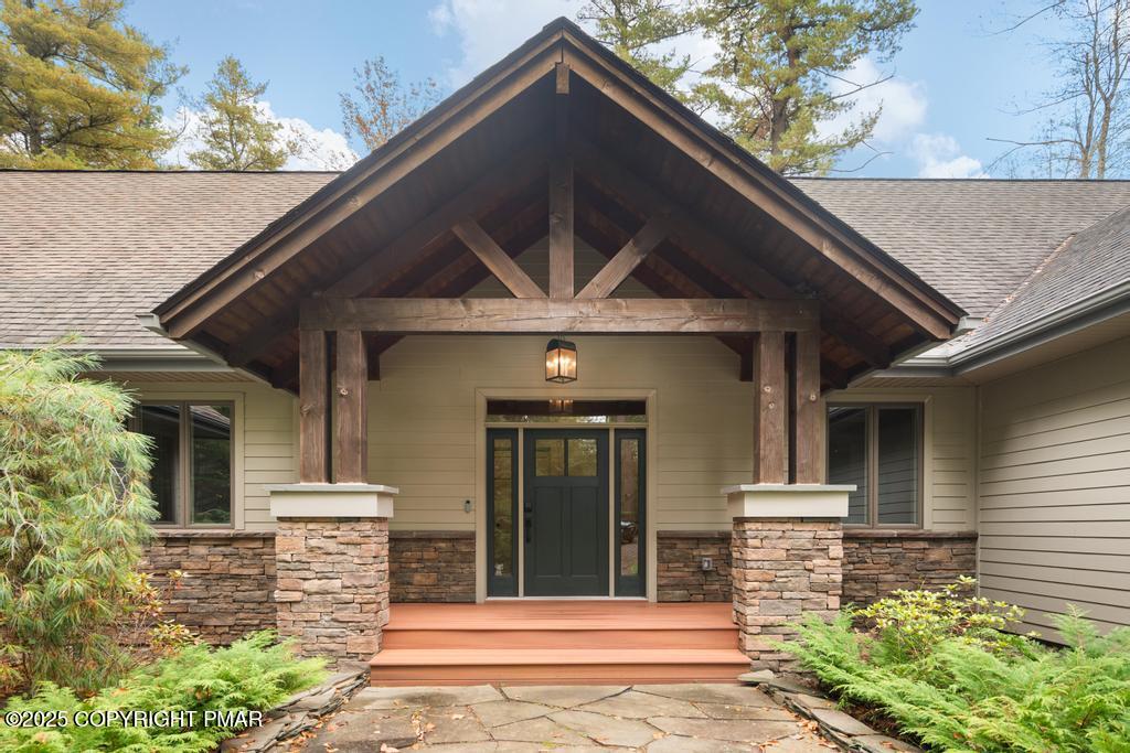 106 Waygood Way Pocono Pines, PA 18350 - Photo 4 of 66 a front view of a house with a garden
