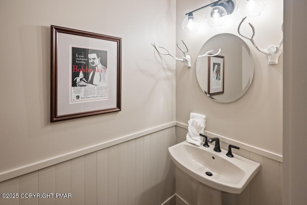 106 Waygood Way Pocono Pines, PA 18350 - Photo 43 of 66 a bathroom with a sink and a mirror