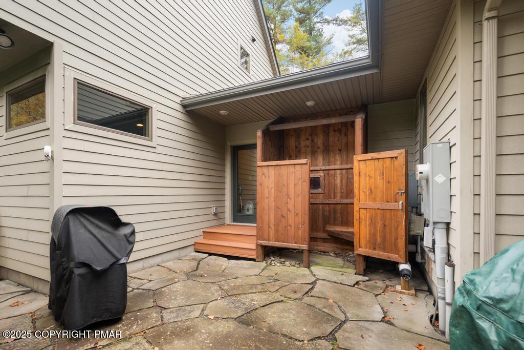 106 Waygood Way Pocono Pines, PA 18350 - Photo 63 of 66 a view of a house with backyard and sitting area