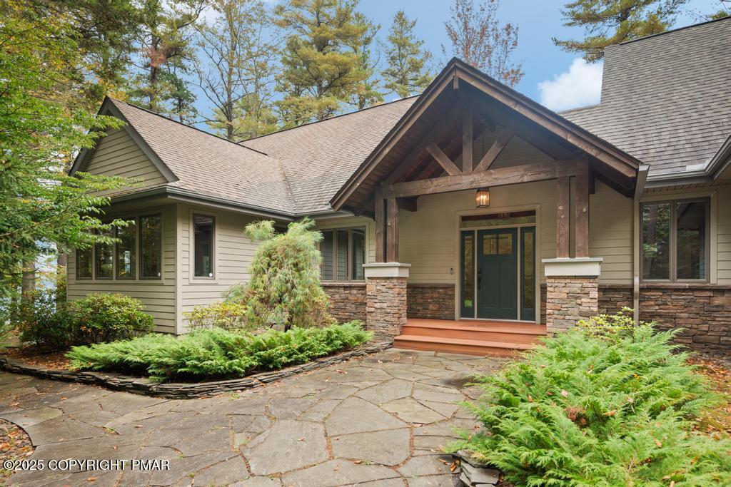 106 Waygood Way Pocono Pines, PA 18350 - Photo 65 of 66 a front view of a house with a garden