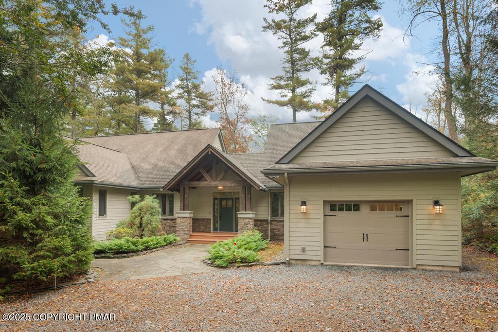 106 Waygood Way Pocono Pines, PA 18350 - Photo 66 of 66 a front view of a house with a garden and plants