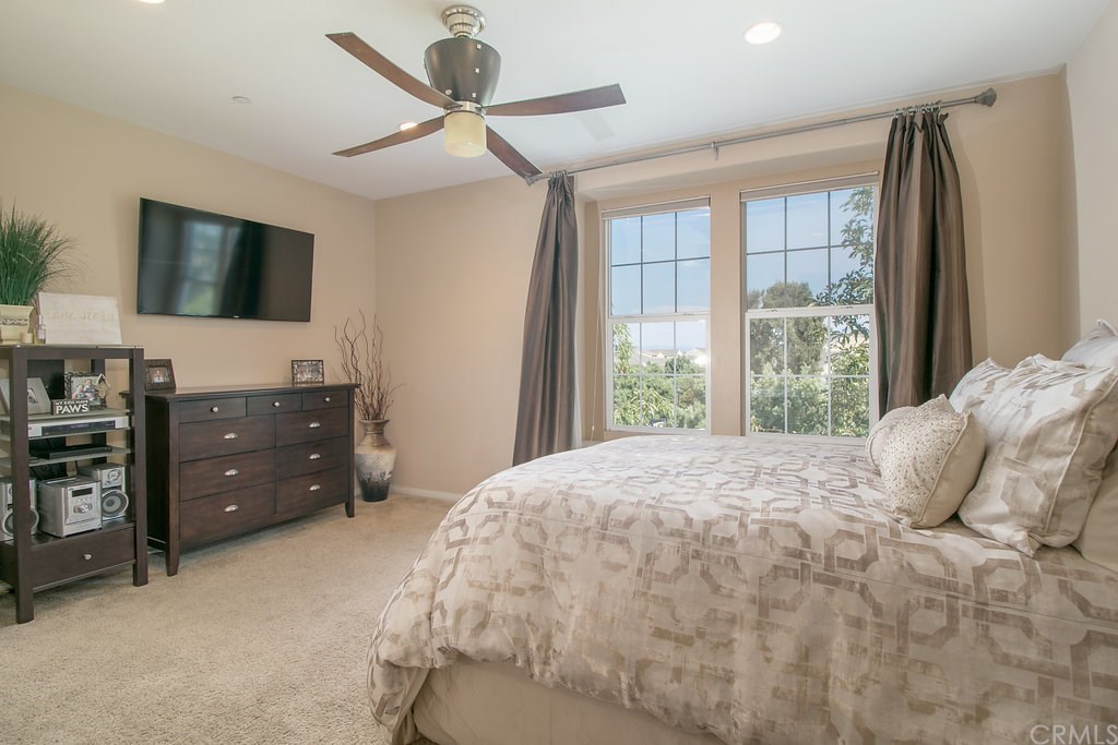 15205 Fairfax Way Tustin, CA 92782 - Photo 16 of 28 a bedroom with a bed and a flat screen tv
