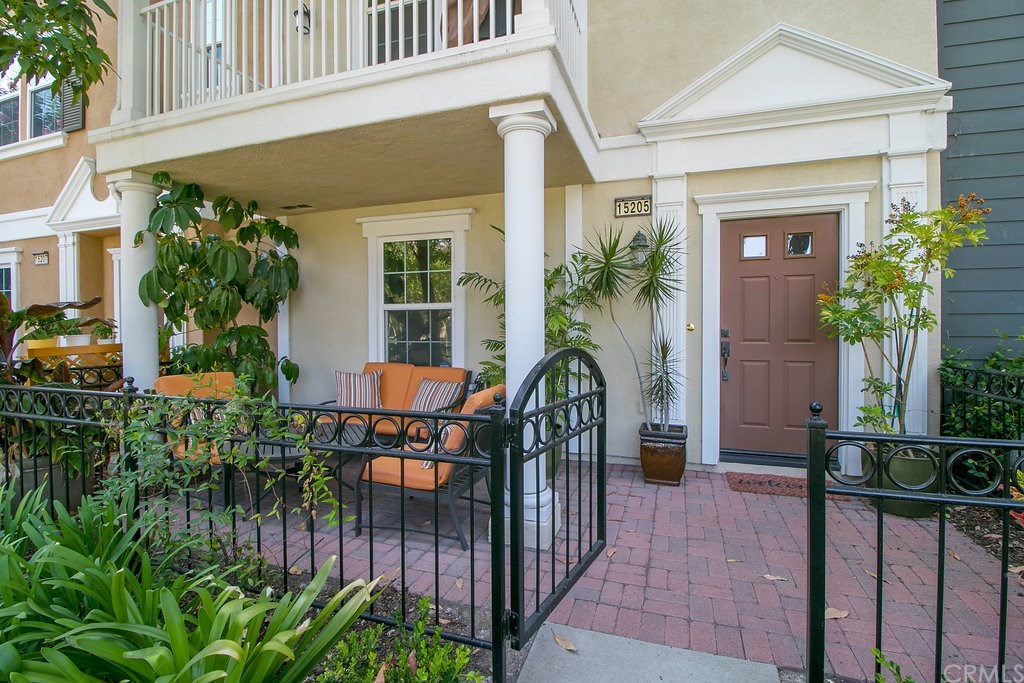 15205 Fairfax Way Tustin, CA 92782 - Photo 2 of 28 a view of balcony with chairs and potted plants