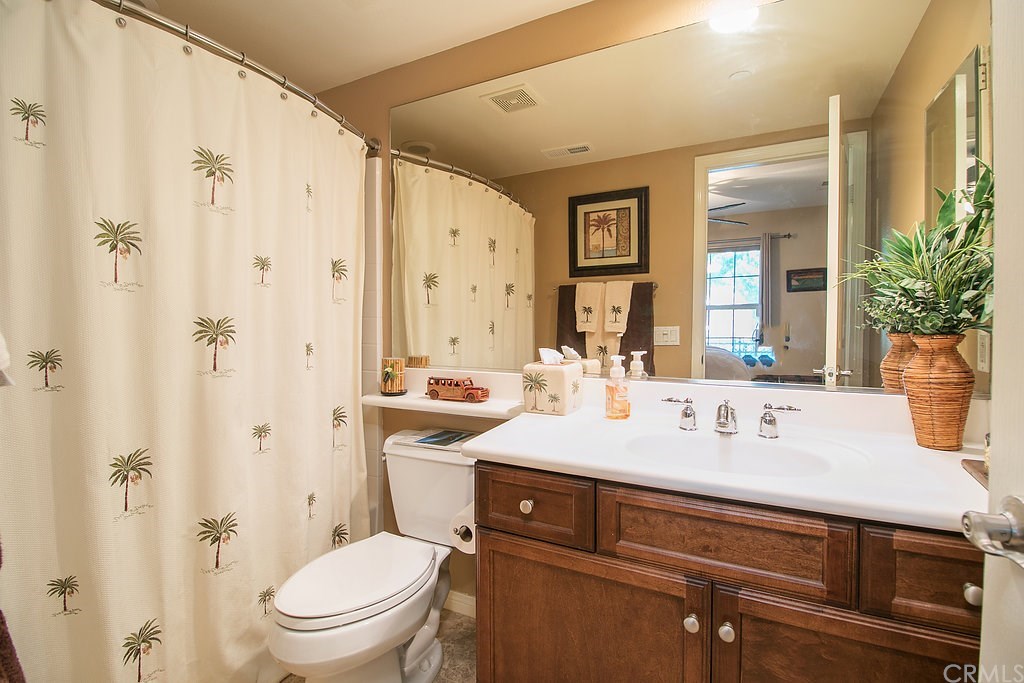 15205 Fairfax Way Tustin, CA 92782 - Photo 6 of 28 a bathroom with a sink a toilet and shower