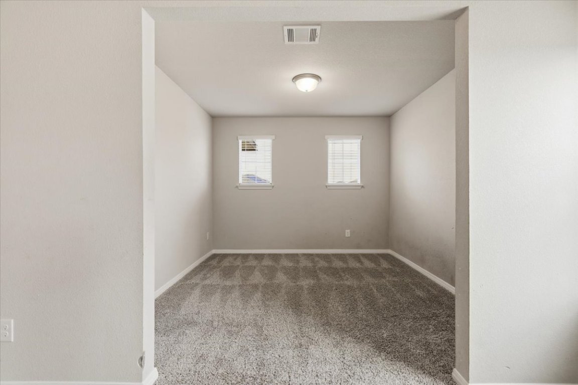 17705 Prairie Land Way Manor, TX 78653 - Photo 15 of 29 an empty room with a window