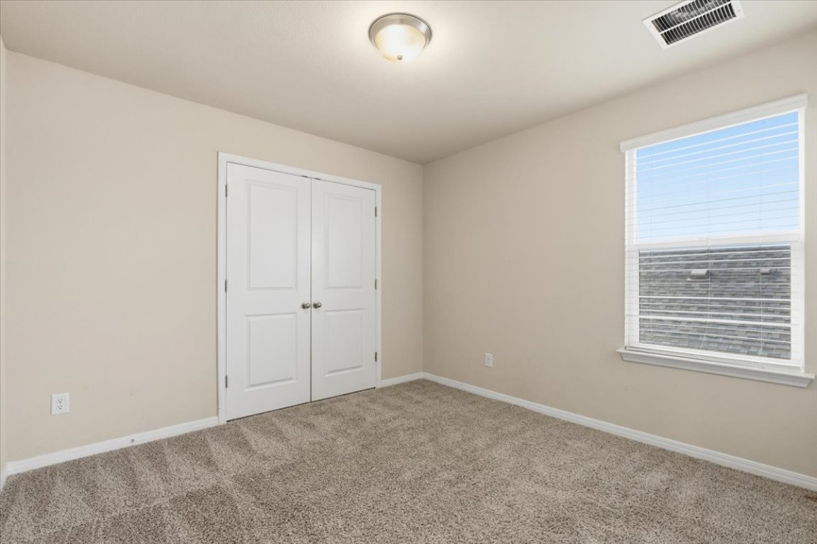 17705 Prairie Land Way Manor, TX 78653 - Photo 16 of 29 a view of an empty room with a window